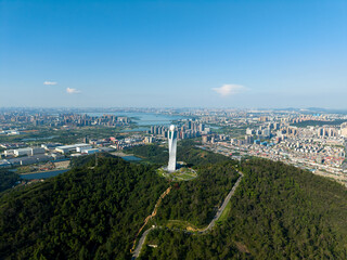 The Jiangxia district of Wuhan presents a striking urban panorama with a meteorological tower...