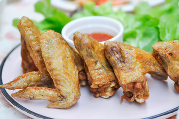 chicken wings or deep fried chicken , fried chicken and sauce