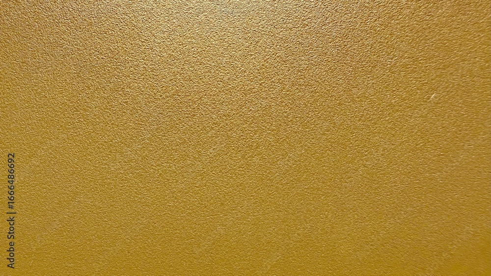 Poster golden metallic textured surface with shimmering light reflection ideal for luxury background or ele