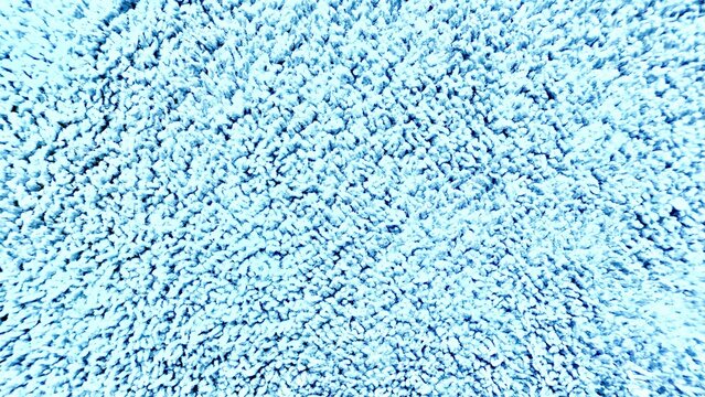 soft light blue shaggy carpet fiber close up with fluffy surface detail perfect for textile background or cozy interior texture - Powered by Adobe