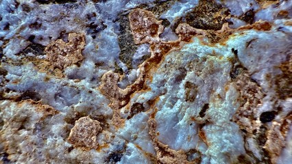 raw quartz stone texture with blue crystal veins and rusty mineral patterns perfect for geology background or abstract design