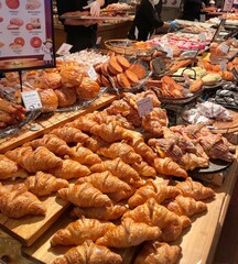 Beautiful and delicious pastries displayed in a bakery, with colorful glazes, delicate toppings, and tempting textures—offering a perfect visual feast of sweetness and artisanal charm.