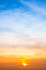 Beautiful , luxury soft gradient orange gold clouds and sunlight on the blue sky perfect for the background, take in evening,Twilight, Large size, high definition landscape photo,Vertical