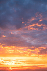 Beautiful , luxury soft gradient orange gold clouds and sunlight on the blue sky perfect for the background, take in evening,Twilight, Large size, high definition landscape photo,Vertical