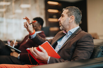 Business professional expressing ideas during a team discussion or meeting. Collaborative work...