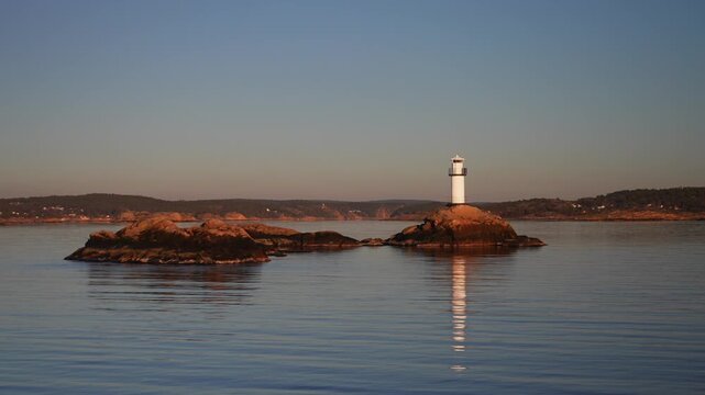 Str&ouml;mstad Stromstad Oslo Fjord Ursholmen Lighthouse Ytre Hvaler National Park Sweden Sverige Norway Norge golden hour Arctic sunlight sunset ferry boat ride Scandinavia islands circle right motion