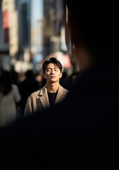 Serene Young Man Meditating Amidst Vibrant City Lights