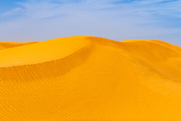 Close-up. Background. The Sahara desert.  Hight sandy dune of Grand Erg Oriental ( Great Eastern Sand Sea). Tunisia, Africa