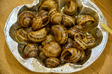 Cooked Escargots Served in Garlic Butter Sauce