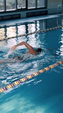 Skilled swimmer trains for competition in clear pool water