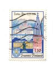 A vintage postage stamp from Finland isolated on a white background.