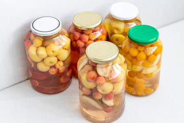 Canned compote in jars of various fruits and berries. Food