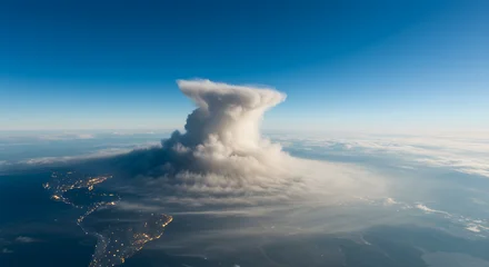  Majestic Cloud Formation: An awe-inspiring aerial perspective showcases a massive cloud formation dominating the skyline, portraying the raw power and beauty of atmospheric phenomena.  © Regan
