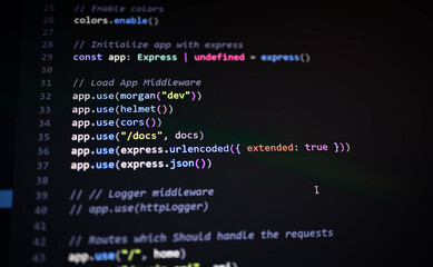 Close-up of Express.js middleware setup in JavaScript backend, showing secure configuration using Helmet, CORS, Morgan, and body parsers for API development.
