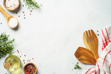 Food background with spices, herbs and utensil on white background.