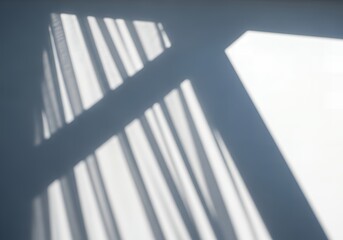 Obraz premium Abstract Light and Shadow Pattern from Window on Textured Wall