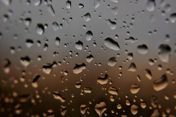 Raindrops on Window with Sunset Colors