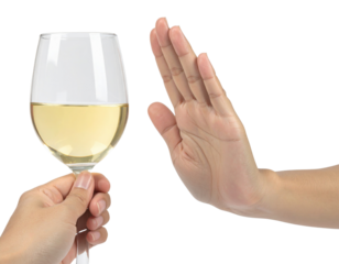A hand is rejecting a glass of white wine, symbolizing refusal or abstinence from alcohol.