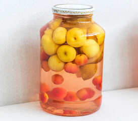 Canned compote in jars of various fruits and berries. Food