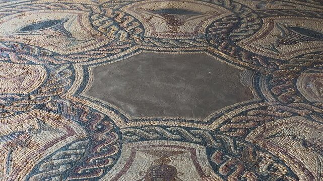 Close up view of ancient roman mosaic in the ruins of Clunia Sulpicia, Burgos, Castile and Leon, Spain. High quality 4k footage