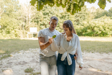 Obraz premium Young couple relax at nature at summer 