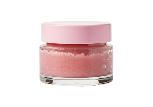 A small, transparent glass jar filled with a light pink, textured scrub sits against a plain black backdrop. - Powered by Adobe