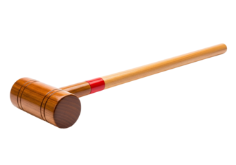 A detailed view of a wooden croquet mallet, showcasing its smooth, light-brown wood grain and a contrasting red band along the shaft.