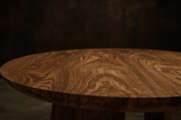 Unique wooden table set against a shadowy background