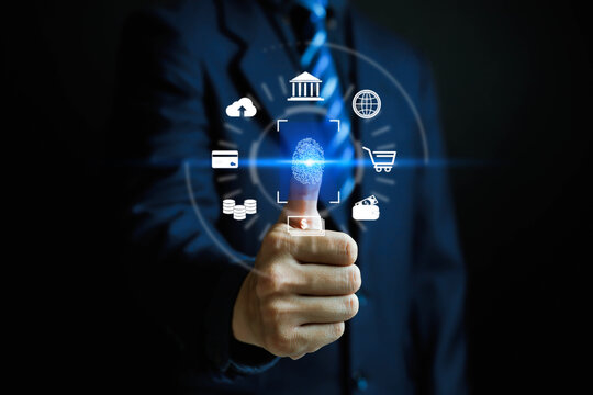 Businessman using fingerprint scan for digital banking and secure payment authentication, symbolizing fintech, online transaction, cybersecurity, and biometric technology in financial services.