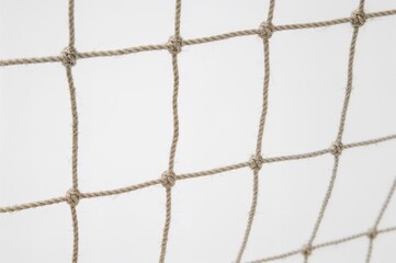 Close-up of a rope mesh resembling a sports net on a white backdrop
