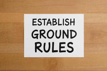 Set Guidelines, text typography on paper over wooden surface, concept for motivation in life and business