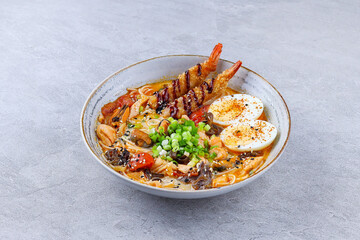 Traditional Japanese ramen with shrimp tempura, boiled egg, and vegetables