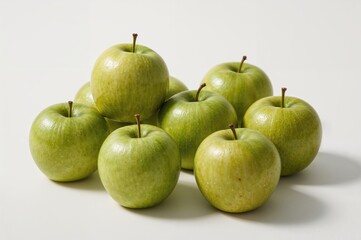 Collection of fresh green apples on a white backdrop