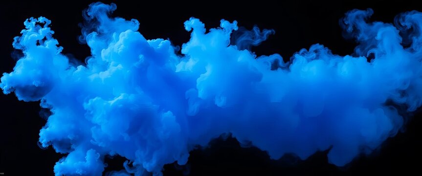 Intense blue smoke bomb explosion against stark black backdrop, design, blue