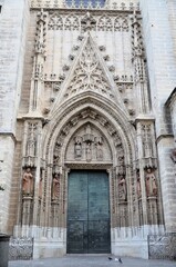 Detail of the Door of the Baptism at the world largest gothic cathedral in Seville, Spain