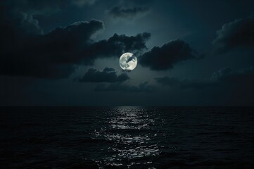 Naklejka na ściany i meble Luminous full moon shining through night clouds above the ocean