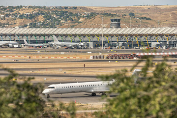 Wide-angle view of the main runway with three aircraft moving simultaneously in different directions