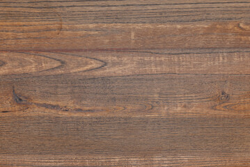 Distressed rustic wood board with natural grain, visible knots, and warm amber tones, perfect for organic backgrounds and craft projects