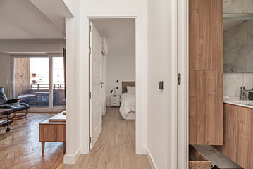 Hallway with floating shelves and drawers under the bench, ideal for organizing shoes and small...