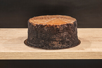 German chocolate cake with a crispy biscuit base, Philadelphia cheesecake, and chocolate chips