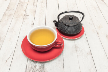 Jasmine Tea with Lychee: An exotic and fragrant drink with whole lychee fruit and jasmine petals floating in an elegant glass