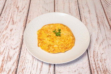 Potato omelet cooked to perfection: golden on the outside but still tender and creamy in the center.
