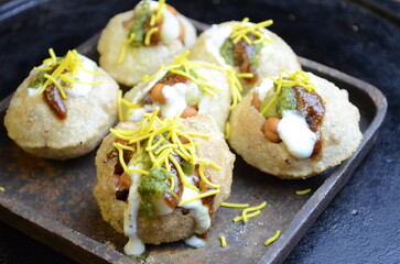 Dahi Puri is a popular Indian chaat made with crispy puris filled with potatoes, chickpeas, tangy...