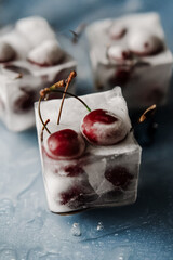 Frozen cherries in ice cubes. High quality photo