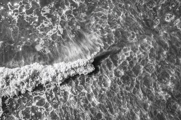 Abstract aerial photography of desert landscapes in black and white, showcasing naturalistic waves and allegorical forms