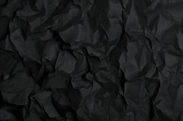 Fototapeta premium Embossed surface with black crumpled paper pattern