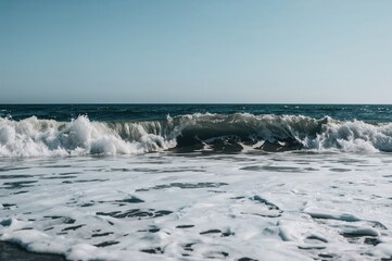 Monochrome ocean wave hitting the shoreline