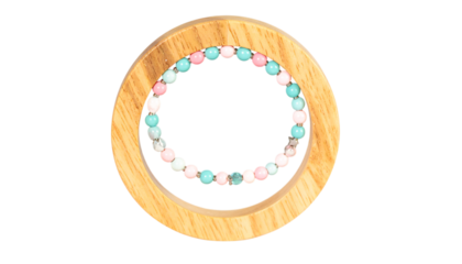Pastel beaded bracelet in a wooden ring on transparent background