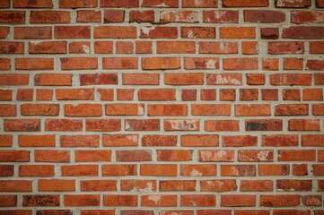 Fototapeta premium Vintage clay brick wall texture and pattern background in warm orange and red tones