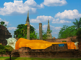 Reclining Buddha, a large yellow Buddha statue from Ayutthaya, an important place in Asia and Thailand.